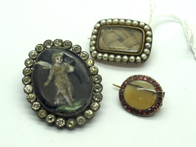 Lot 127 - An Antique Pearl and Hair Work Mourning Brooch,...