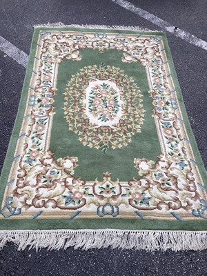 Lot 1544 - Tassled Wool Rug with floral decoration to...