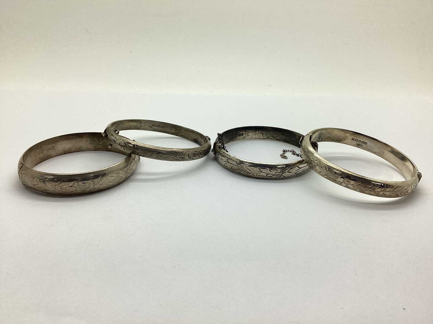 Lot 188 - A Hallmarked Silver Hinged Bangle, of etched...