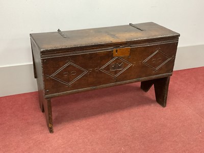 Lot 1581 - A Mid XVII Century Oak Plank Top Coffer, the...