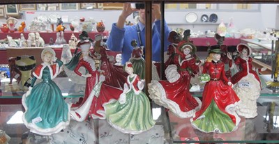 Lot 1299 - Royal Doulton Christmas themed lady figurines...