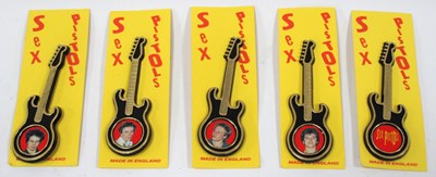 Lot 1279 - Sex Pistols, guitar brooches, four featuring a...