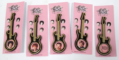 Lot 1280 - Queen Guitar Brooches, four featuring a group...