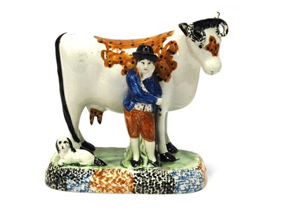 Lot 1133 - A Mexborough Pearlware Pottery Model of a Cow,...