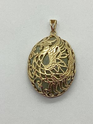 Lot 123 - A Modern Jade Pendant, with stylised bird...
