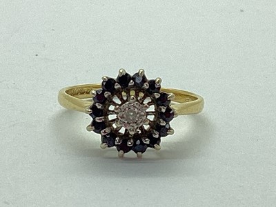 Lot 43 - An 18ct Gold Diamond and Stone Set Cluster...