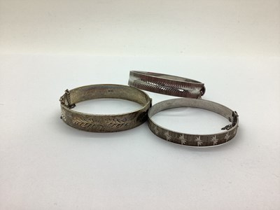 Lot 190 - A Hallmarked Silver Hinged Bangle, with an...