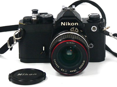 Lot 1375 - Nikon FM 35mm Camera, black, No. FM2571563,...