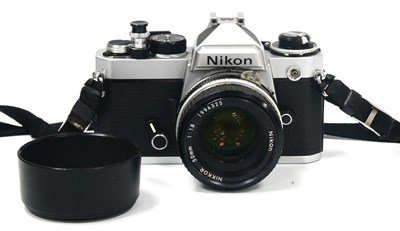 Lot 1374 - Nikon FE 35mm Camera, chrome, No. FE4079177,...