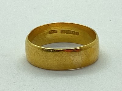 Lot 36 - A 22ct Gold Wide Wedding Band, (misshapen)...