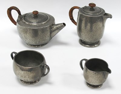 Lot 1245 - An Early 1900s Four-Piece 'Tudric' Pewter Tea...
