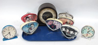 Lot 1472 - 1950s Style Triangular Cased Bedside Clocks...