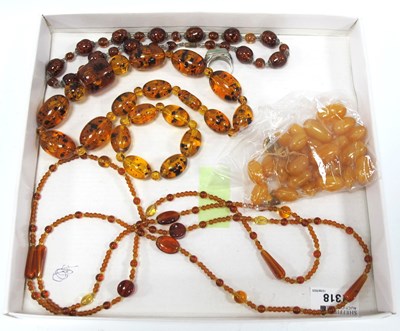 Lot 1318 - Three Amber Coloured Necklaces, bracelet,...