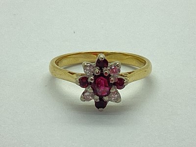 Lot 69 - A Ruby and Diamond Cluster Dress Ring, claw...