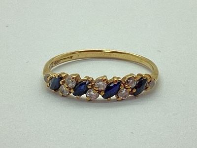 Lot 67 - A 9ct Gold Sapphire and CZ Dress Ring,...