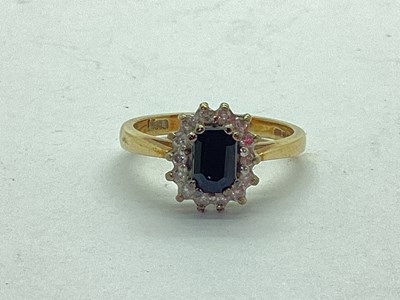 Lot 57 - A 9ct Gold Sapphire and Diamond Cluster Ring,...