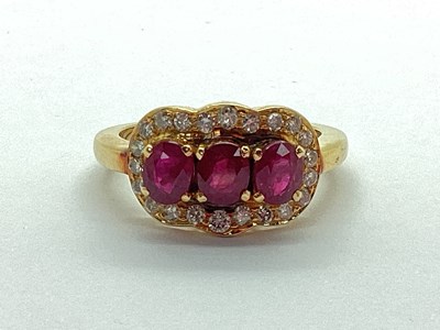 Lot 65 - A Modern Ruby and Diamond Dress Ring, oval...