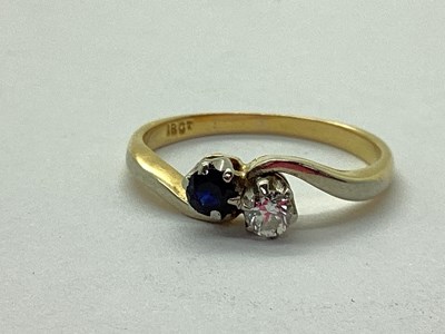Lot 47 - A Sapphire and Diamond Two Stone Ring, claw...