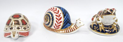 Lot 1186 - Three Royal Crown Derby Porcelain Paperweights,...