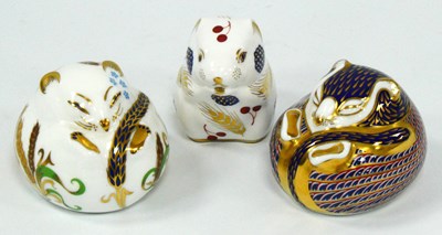Lot 1074 - Three Royal Crown Derby Porcelain Paperweights,...