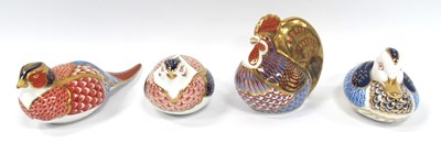 Lot 1183 - Four Royal Crown Derby Porcelain Paperweights...