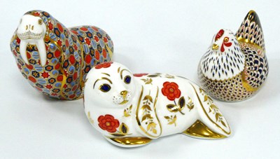 Lot 1069 - Three Royal Crown Derby Porcelain Paperweights,...