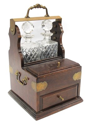 Lot 1359 - A Two Bottle Tantalus, complete with two...