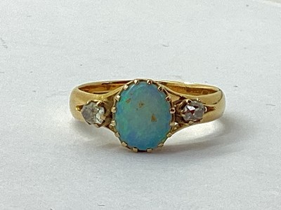 Lot 80 - An Opal and Diamond Dress Ring, oval claw set,...