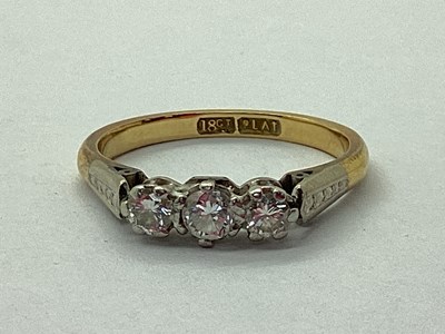 Lot 92 - A Three Stone Diamond Ring, claw set...