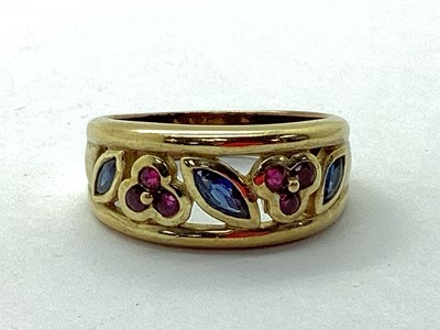 Lot 91 - A Ruby and Sapphire Dress Ring, of foliate...