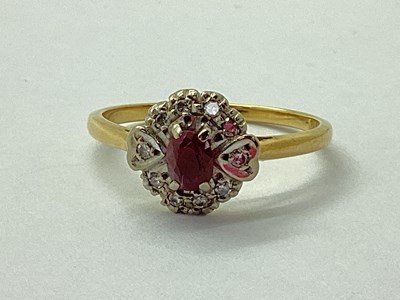 Lot 96 - An 18ct Gold Ruby and Diamond Cluster Ring,...