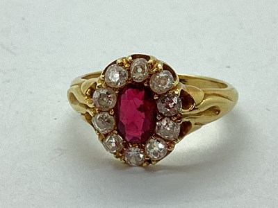 Lot 52 - An Antique Ruby and Diamond Oval Cluster Ring,...