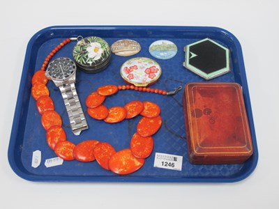 Lot 1246 - A silver and enamel compact, top having black...