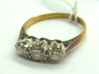 Lot 193 - A Three Stone Diamond Ring, claw set with...