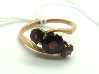 Lot 216 - A Vintage Three Stone Crossover Dress Ring,...
