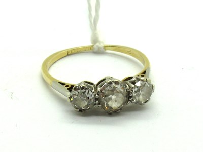 Lot 203 - A Three Stone Diamond Ring, claw set with...