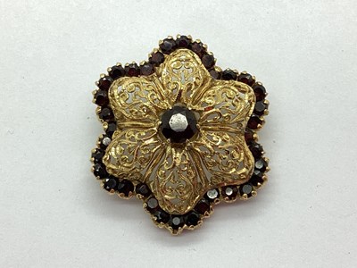 Lot 89 - A Highly Decorative Garnet Set Brooch, of dome...