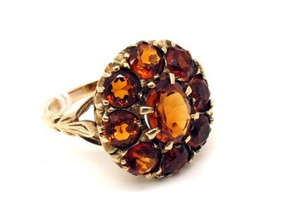 Lot 148 - A Large Cluster Dress Ring, claw set...