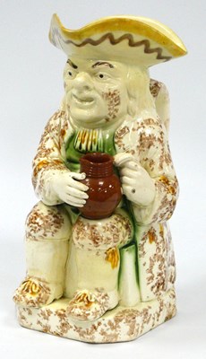 Lot 1043 - An Early XIX Century Pottery Toby Jug, with...