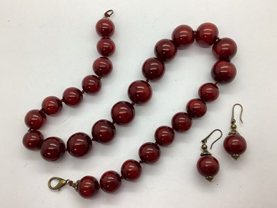 Lot 141 - A Modern Graduated Red Bead Necklace, with...