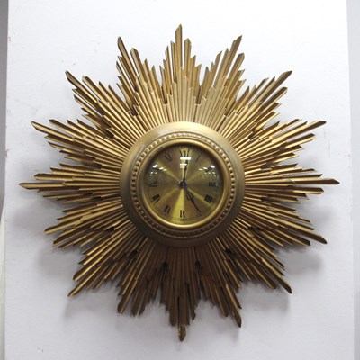 Lot 1563 - Gilt Wood Sunburst Wall clock, with black...