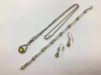 Lot 130 - An Oval Cabochon Set Pendant, within openwork...