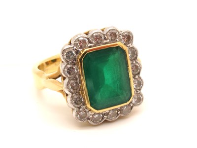 Lot 117 - A Large 18ct Gold Emerald and Diamond Cluster...