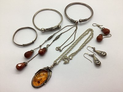 Lot 149 - A Modern Amber Pendant, with leaf design mount,...