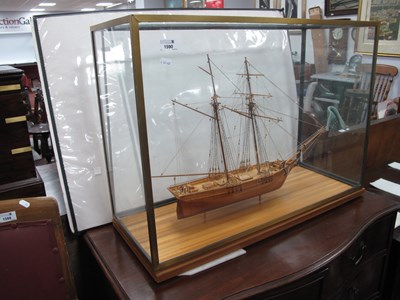 Lot 1590 - A wooden hand built model ship in a large...