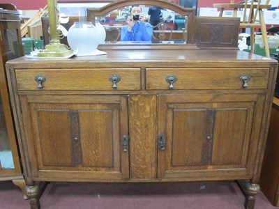 Lot 1561 - 1930s Oak Sideboard, with arched mirror back,...