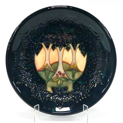 Lot 1031 - A Moorcroft Pottery Plate, of circular form...