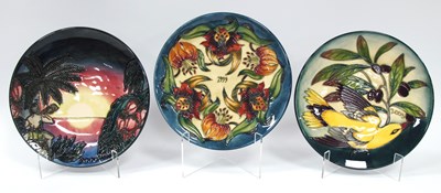 Lot 1129 - Three Moorcroft Pottery Circular Year Plates,...