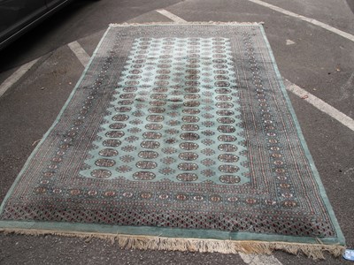 Lot 1594 - Middle Eastern Tassled Carpet, with four banks...