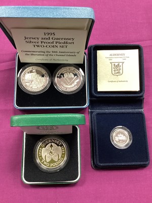 Lot 623 - Four Royal Mint Silver Proof Coins, including...